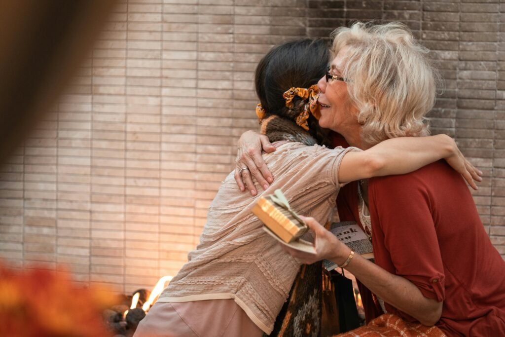 An Elderly Woman Hugging a Person